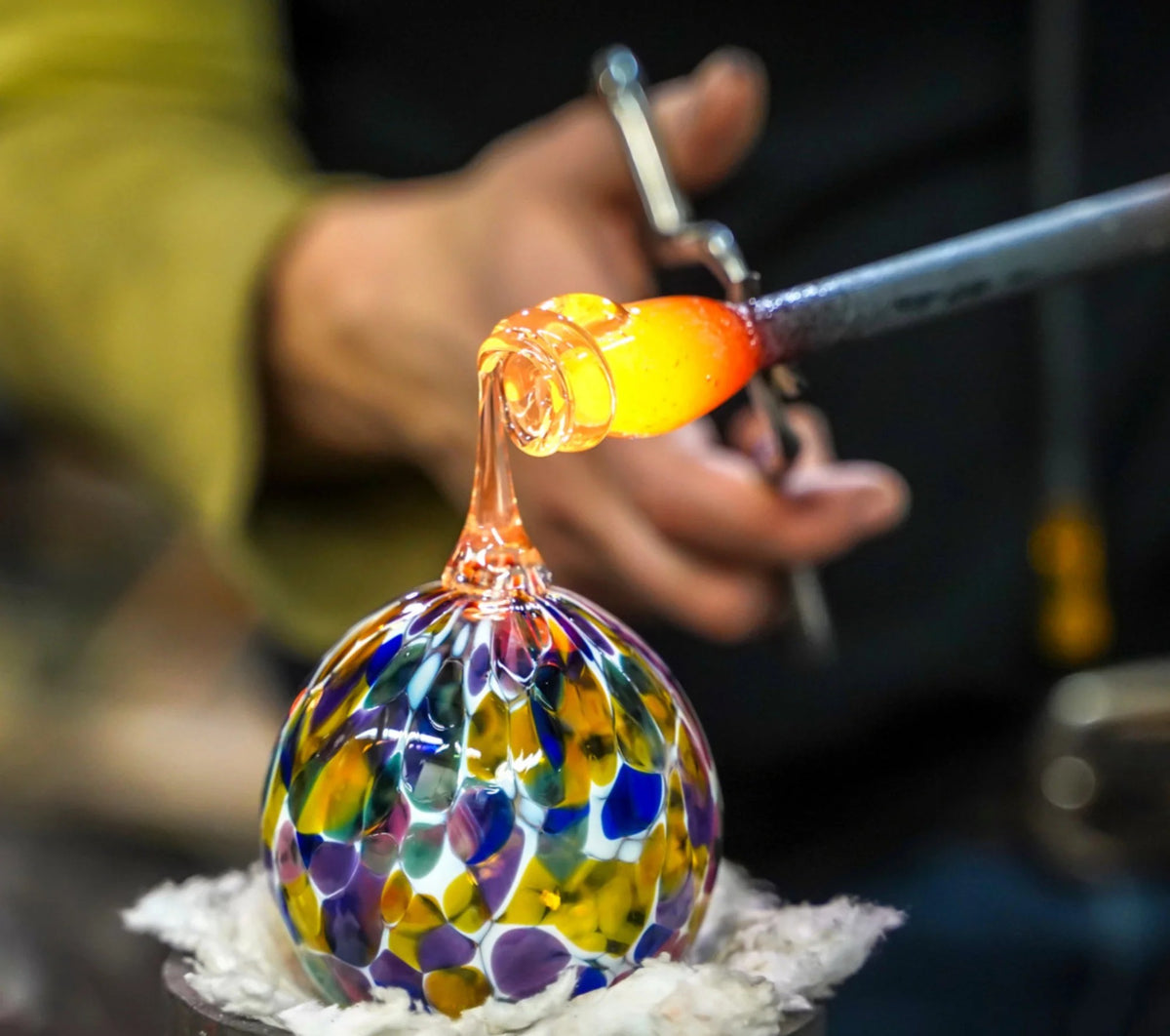 Murano glass master shaping glass by flame